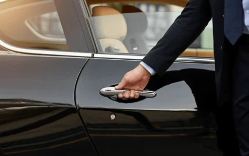 businessman-hands-chauffeur-by-car-600nw-2315443469
